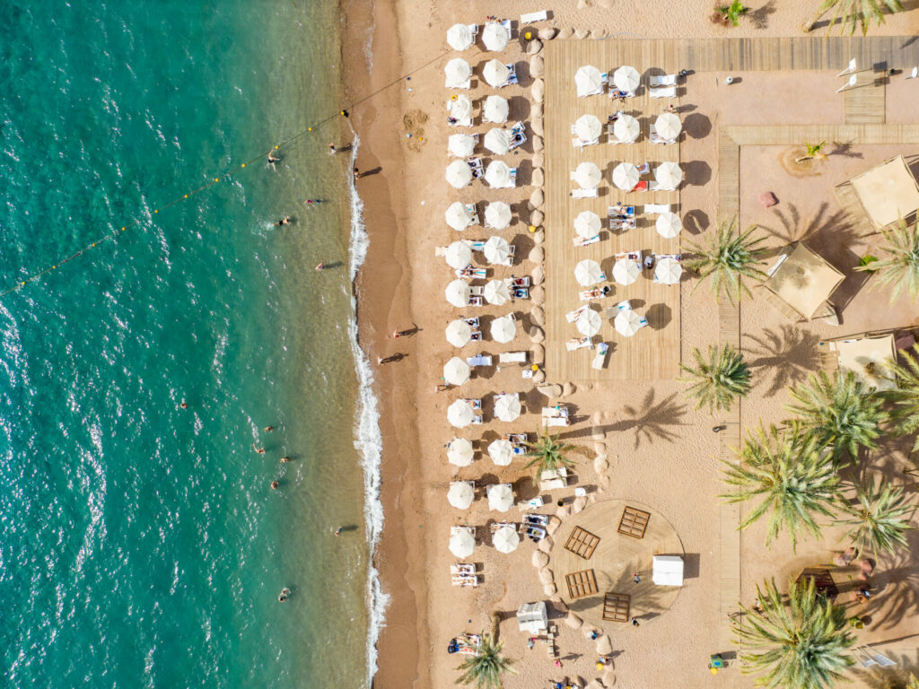 aerial,view,of,the,shoreline,,with,shade,suds,in,eilat,